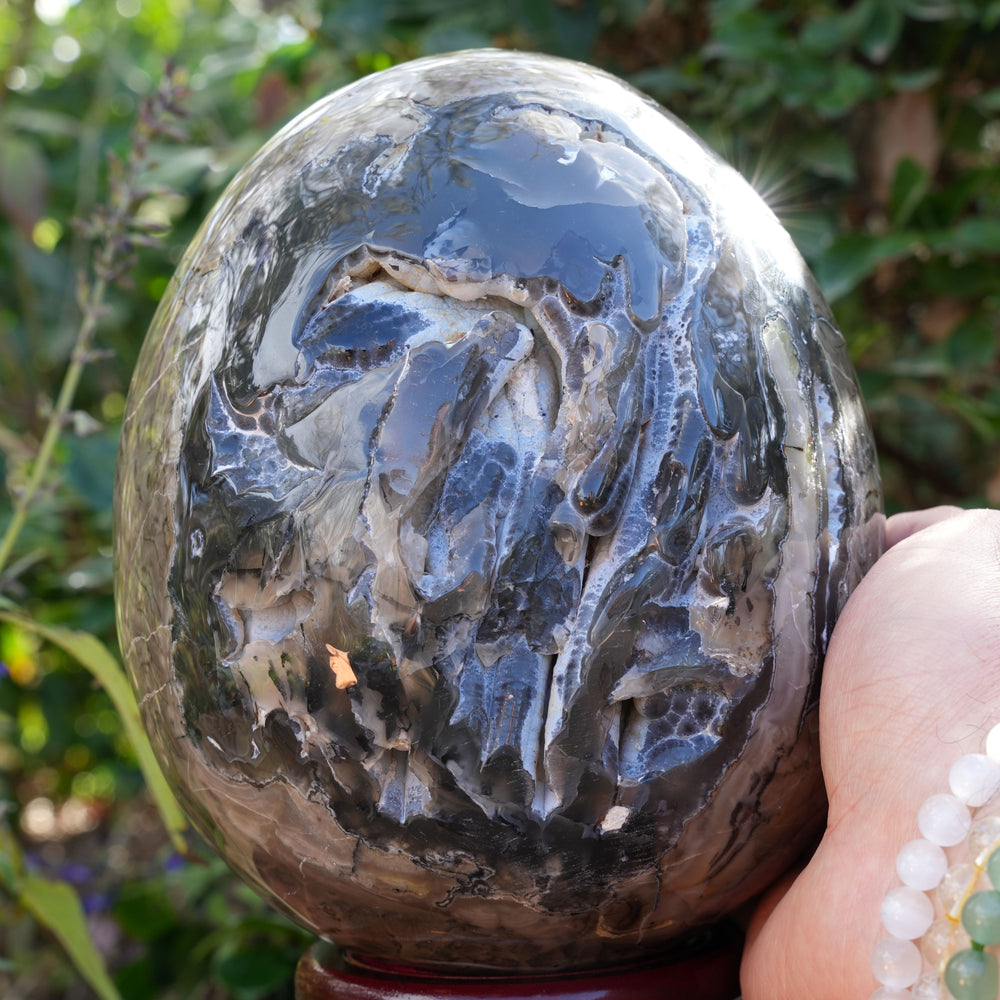 
                  
                    UV Reactive Volcanic Agate Egg on Wooden Stand | Reiki Infused
                  
                